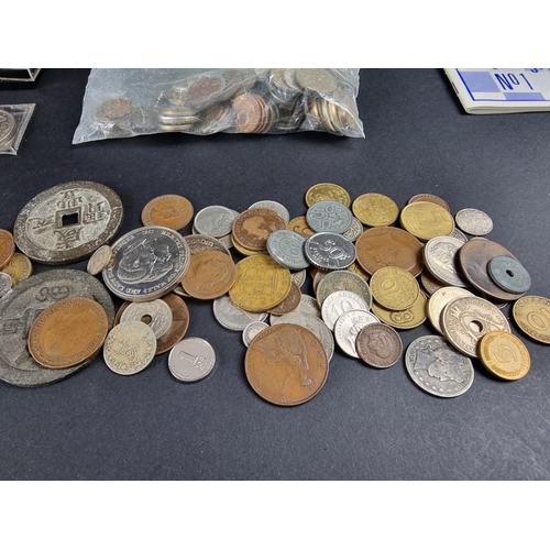 516 - Coins: a quantity of UK and world coins and banknotes.