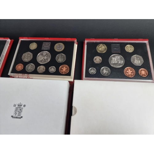 518 - Coins: five UK proof coin collections; together with six collectable fifty pence coins; and various ... 