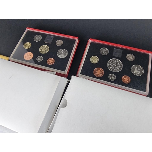 518 - Coins: five UK proof coin collections; together with six collectable fifty pence coins; and various ... 