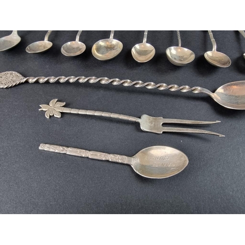 69 - A group of white metal cutlery, to include Chinese examples. (13)