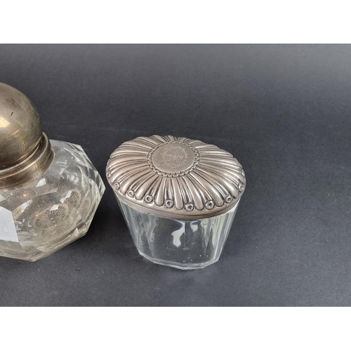 86 - Two silver mounted glass inkwells; and a silver topped glass jar. (3)