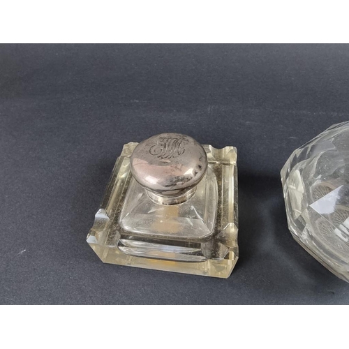 86 - Two silver mounted glass inkwells; and a silver topped glass jar. (3)