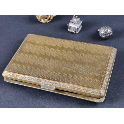 99A - A gilt metal and blue guilloche enamel cigarette case, 87cm high; together with a rolled gold propel... 