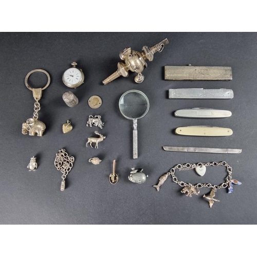 99B - A silver child's rattle; together with a silver mounted comb; a silver thimble and various other sil... 