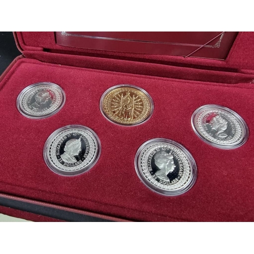 522 - Coins: a Royal Australian Mint silver coin and medallion set commemorating the 40th anniversary of H... 