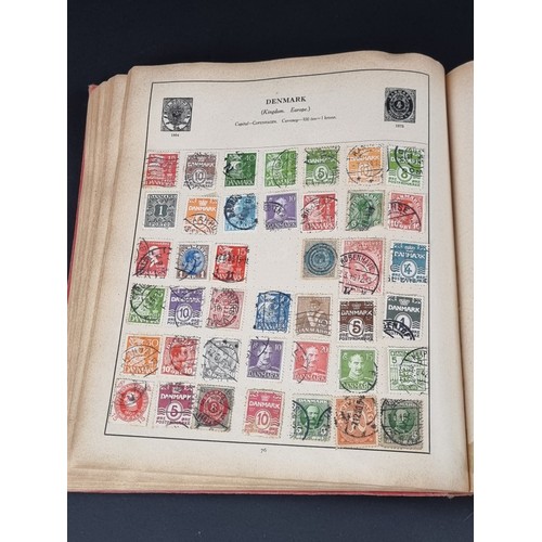 1506A - A strand stamp album containing a collection of mixed commonwealth and all world stamps, Victoria to... 