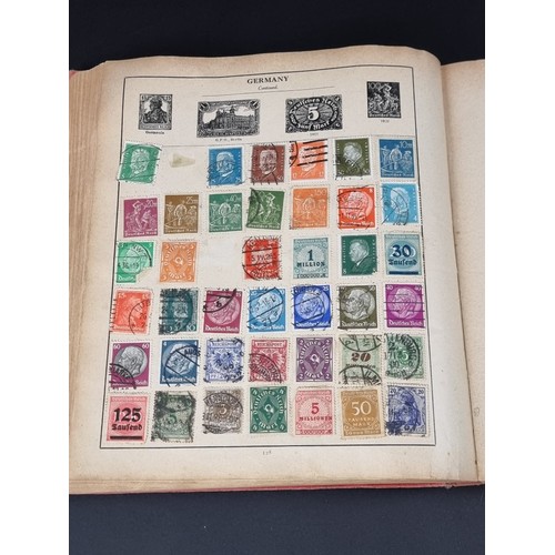 1506A - A strand stamp album containing a collection of mixed commonwealth and all world stamps, Victoria to... 