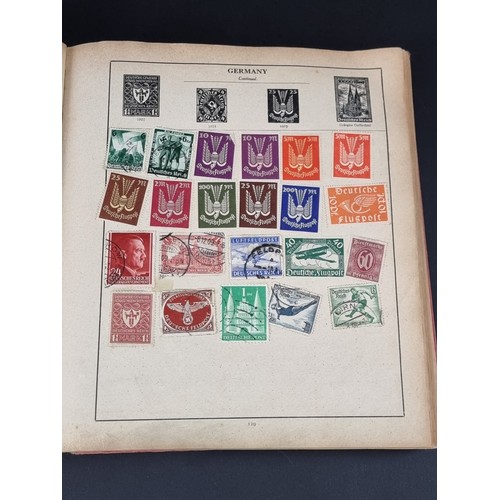 1506A - A strand stamp album containing a collection of mixed commonwealth and all world stamps, Victoria to... 