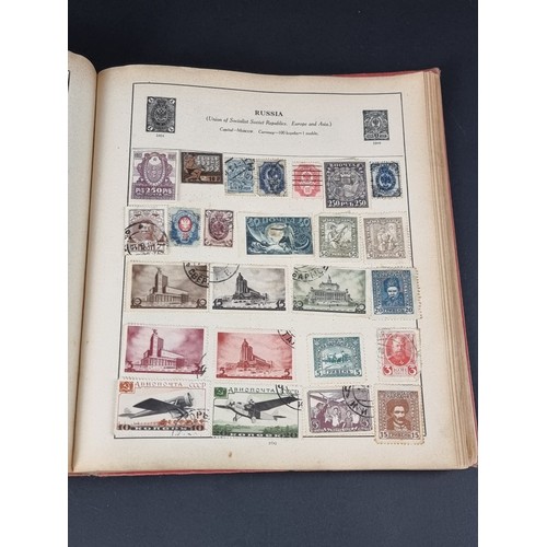 1506A - A strand stamp album containing a collection of mixed commonwealth and all world stamps, Victoria to... 