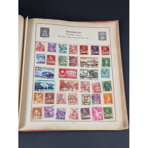 1506A - A strand stamp album containing a collection of mixed commonwealth and all world stamps, Victoria to... 