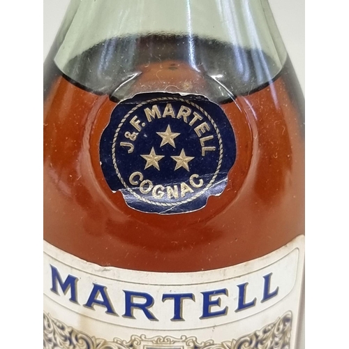 31 - An old 12 fl.oz. bottle of Martell 'Three Star' Cognac, probably 1970s bottling.