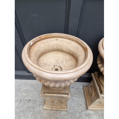 1104 - A pair of Victorian salt glazed Campana urns and pedestals, 94cm high x 51.5cm diameter. (2)... 