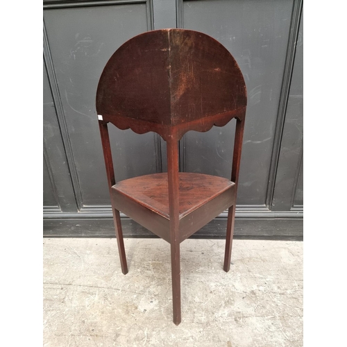 1005 - A George III mahogany corner washstand, 101cm high.