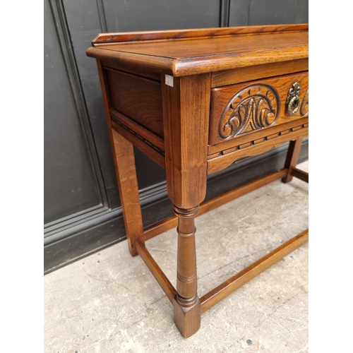 1006 - An 'Old Charm' oak two drawer side table, 106.5cm wide.