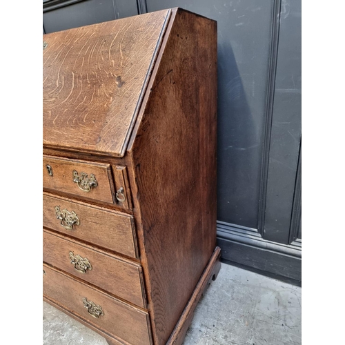 1013 - An 18th century oak bureau, 91.5cm wide.