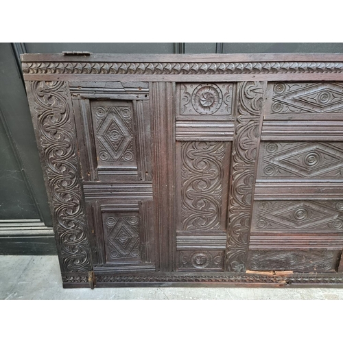 1027 - A carved oak panel, 17th century and later, 186.5 x 85cm, (made up).