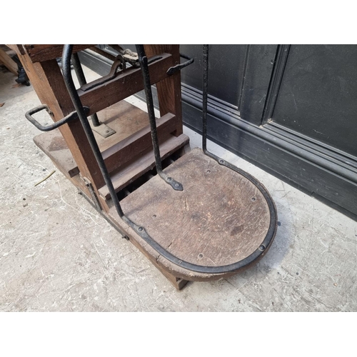 1034 - A set of antique oak and steel potato scales, by 'W.S Barrett & Son, Boston', 91cm wide.... 