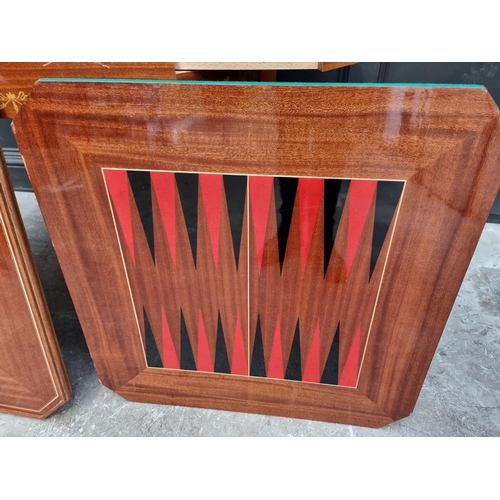 1038 - An Italian marquetry games table, incorporating a roulette wheel, backgammon and chequerboard, 74cm ... 