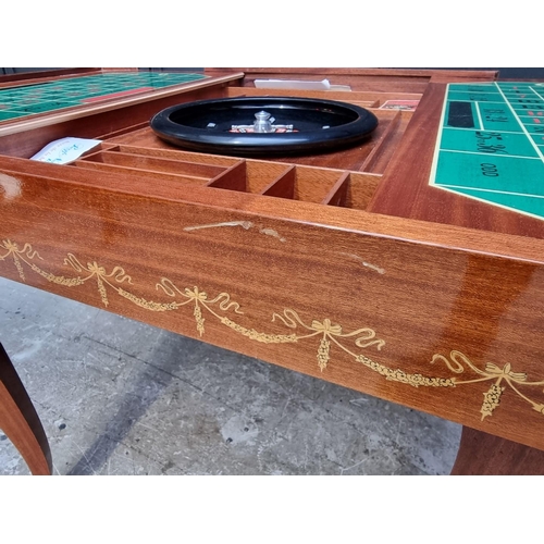 1038 - An Italian marquetry games table, incorporating a roulette wheel, backgammon and chequerboard, 74cm ... 