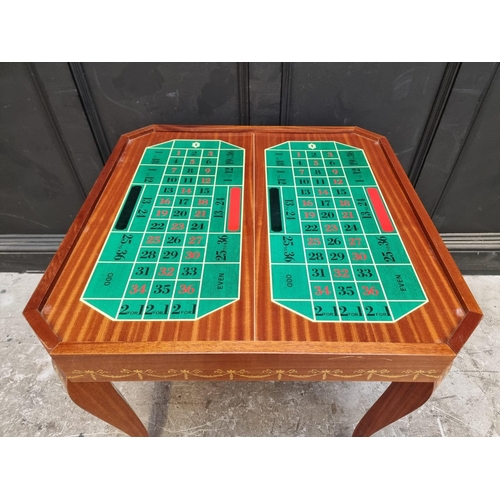 1038 - An Italian marquetry games table, incorporating a roulette wheel, backgammon and chequerboard, 74cm ... 