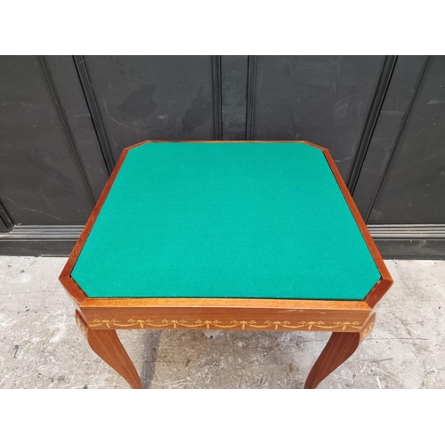 1038 - An Italian marquetry games table, incorporating a roulette wheel, backgammon and chequerboard, 74cm ... 