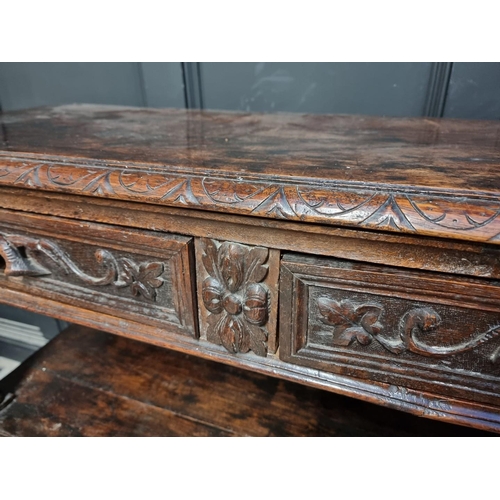 1050 - A late Victorian carved oak three tier buffet, 120cm wide.