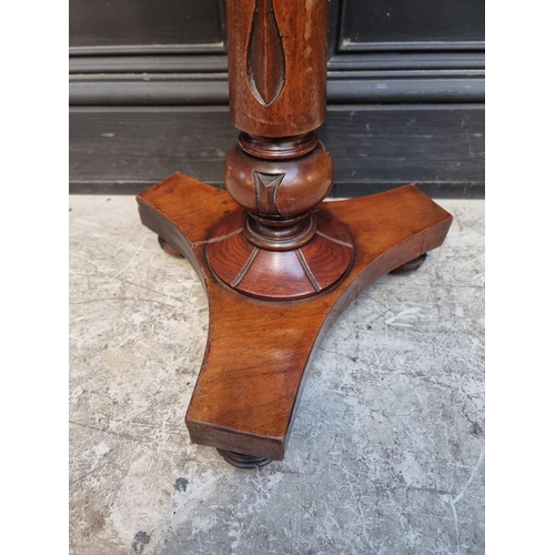 1056 - A mahogany octagonal tripod table, 39cm wide.