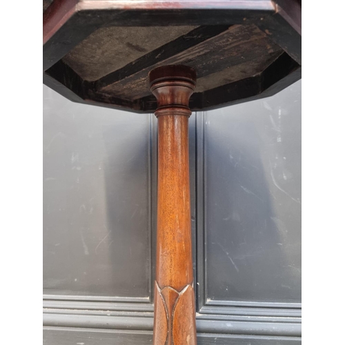 1056 - A mahogany octagonal tripod table, 39cm wide.