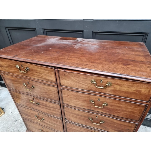 1064 - An antique mahogany side cabinet, the pair of cupboard doors simulating drawers, 108.5cm wide.... 