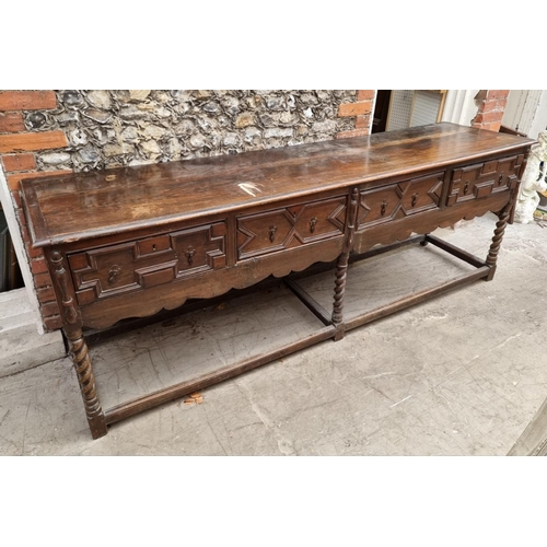 1065 - A large antique oak dresser base, 240.5cm wide.