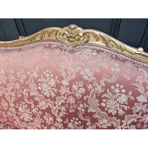 1078 - A Louis XV style carved giltwood settee, 156cm wide.