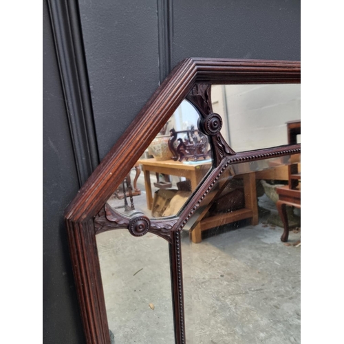 1095 - An Edwardian carved mahogany framed octagonal wall mirror, 106 x 78cm.