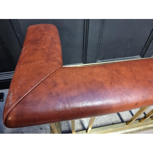 1103 - A large brass and tan leather club fender, 190cm wide.