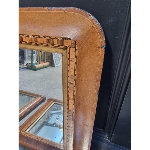 1106 - A pair of late Victorian walnut and parquetry overmantel mirrors, 48 x 81cm; together with a si... 