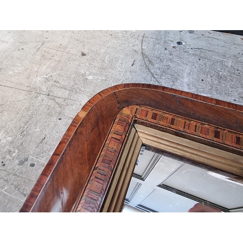 1106 - A pair of late Victorian walnut and parquetry overmantel mirrors, 48 x 81cm; together with a si... 