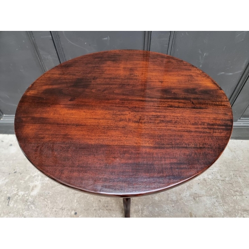 1110 - A mahogany circular tilt-top tripod table, 74cm diameter.