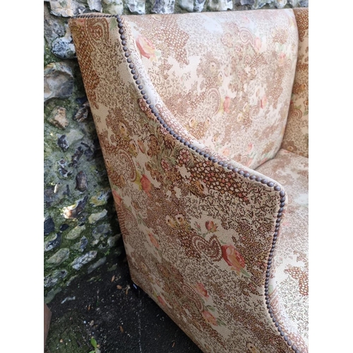 1131 - An antique wingback settee, 123cm wide.