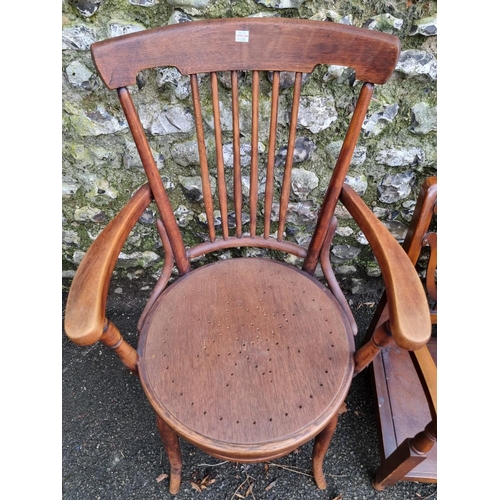 1135 - An antique beech elbow chair; together with a 1930s walnut low occasional chair. (2)... 