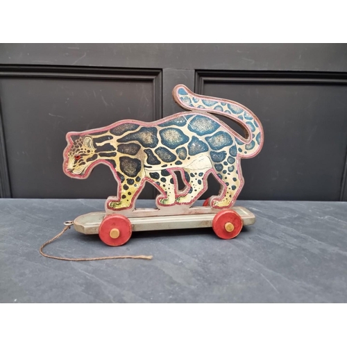 1182 - A child's pull-along toy leopard, 40cm long.