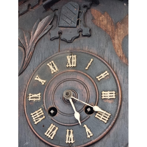 1184 - A old oak cuckoo mantel clock, 42.5cm high, (no pendulum).