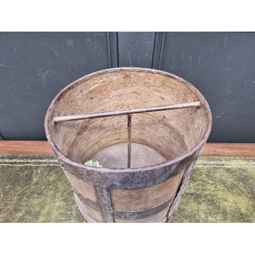 1185 - An old oak and metal bound bucket, possible a grain measure, 33cm high.