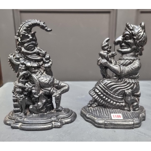 1186 - A matched pair of cast iron 'Punch' & 'Judy' doorstops, 30.5cm high.