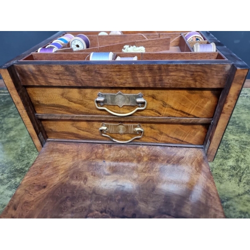 1196 - A late Victorian figured walnut work box, 34cm wide.