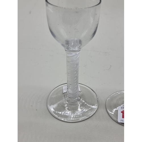 1254 - An antique double series opaque and airtwist wine glass, 17cm high; together with another opaque twi... 