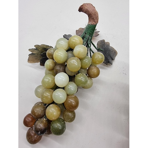 1259 - A collection of Chinese carved hardstone fruit, to include: six bunches of grapes.... 