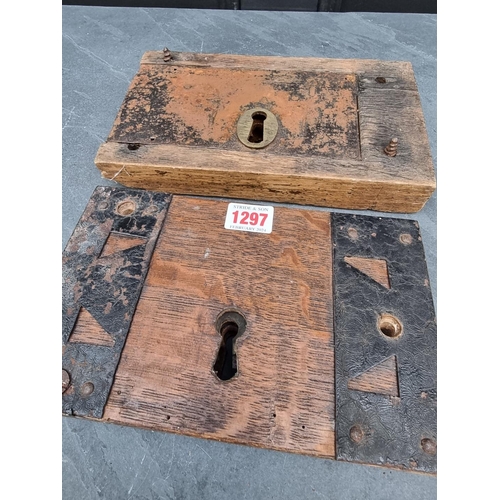 1297 - Two large antique oak and steel door locks. (2)