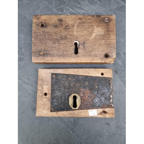 1297 - Two large antique oak and steel door locks. (2)