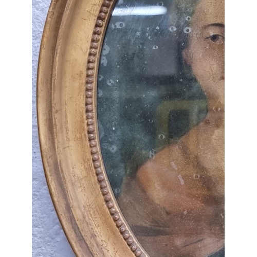 1318 - An antique reverse glass portrait of a lady, 19.5 x 14.5cm oval.