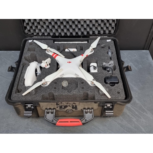 1328 - A DJI 'Phantom 2 Vision+' drone, with two batteries, charger, and controller, in fitted travel case,... 