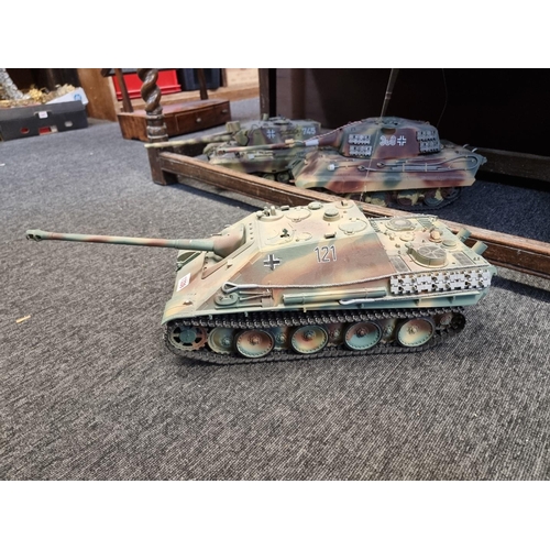 1339 - Five remote control tanks, to include: examples by Tamiya, largest approx. 65cm long, with four remo... 